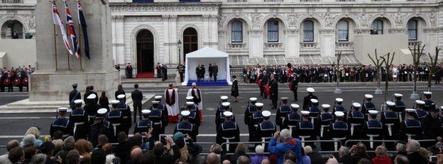 Queen Elizabeth II (C), prepares to lay a wreath during a commemorative ceremony marking Anzac day