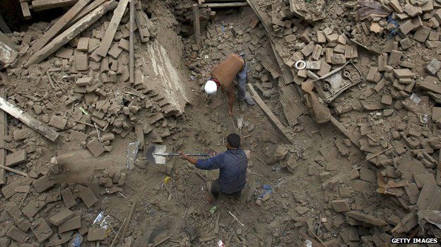 Rescuers using shovels