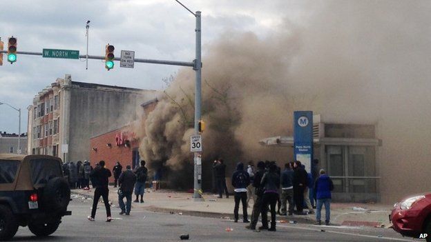 Smoke billows from a CVS Pharmacy store in Baltimore