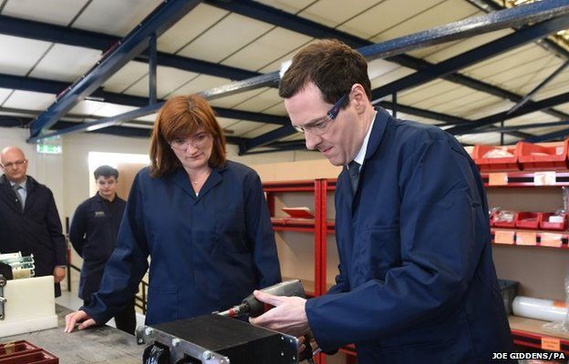 Chancellor George Osborne uses an air drill to tighten a nut, with Secretary of State for Education Nicky Morgan (left) during a visit to EPS engineering company in Loughborough, Leicestershire
