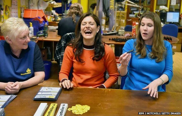 Miriam Gonzales Durantez (centre), the wife of the Liberal Democrat leader Nick Clegg visits Scottoiler, an award winning motorcycle chain lubricant manufacturer with Jo Swinson (right)