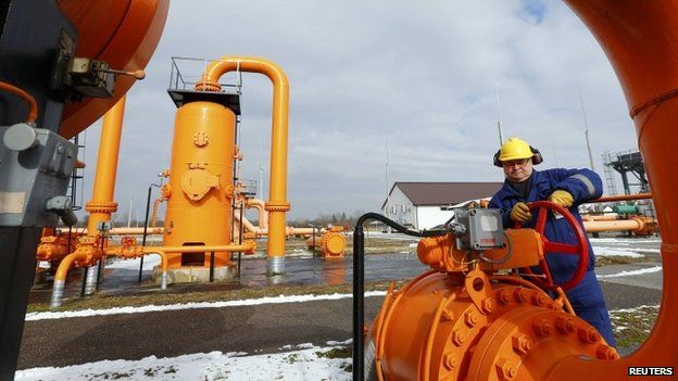 An engineer checks gas pipe supply in Europe