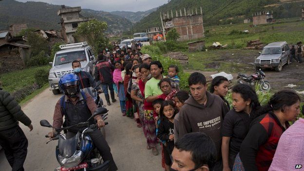 Queue to receive food being distributed in Sakhu, on the outskirts of Kathmandu. 29 Apr 2015