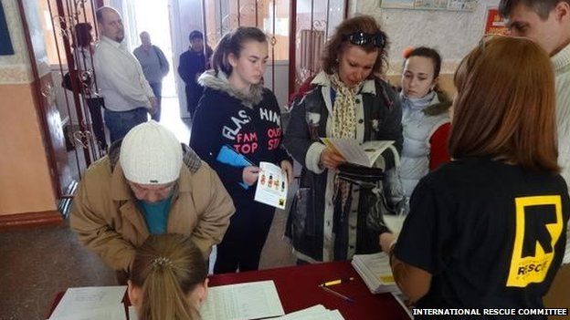 AN IRC team distributes women's hygiene and safety equipment in eastern Ukraine