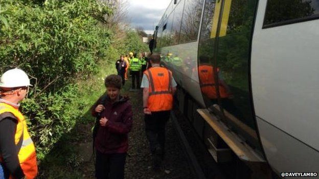 Passengers being evacuated from a train