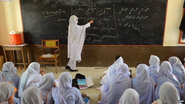A Pakistani teacher leading a class of girls at a school in Mingora, the main town of Swat valley (July 2013)