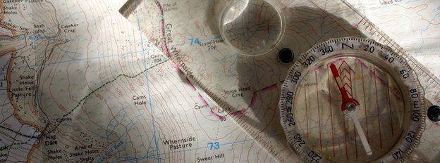 Ordnance Survey map and compass