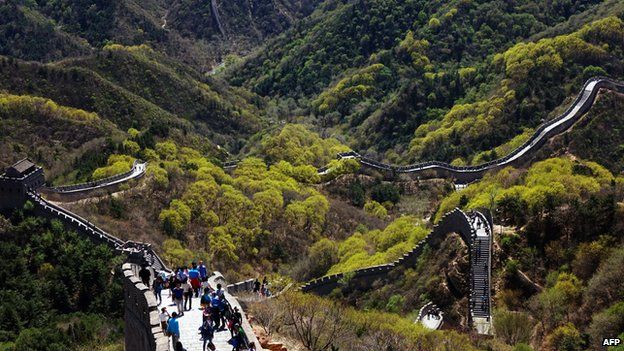 Chinese tourists climb the Great Wall at Badaling, north of Beijing, on April 22, 2015