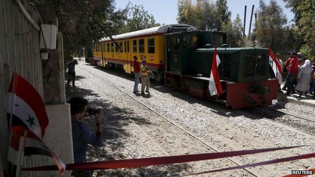 People attend the relaunch of the train service in Damascus. Photo: 1 May 2015
