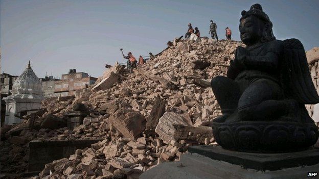Nepalese Armed Police Force clear rubble at the Narayan temple in Kathmandu