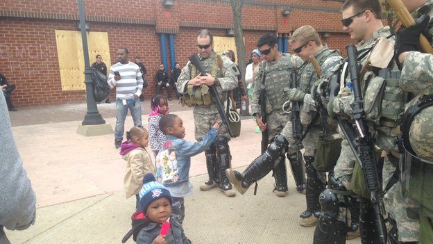 Baltimore children play with National Gaurdsmen