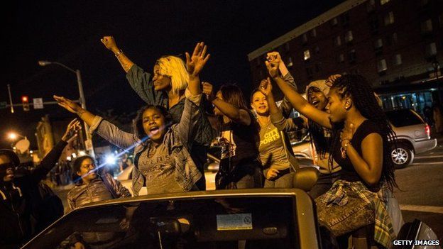 Protesters party in the streets after criminal charges were announced against six police officers