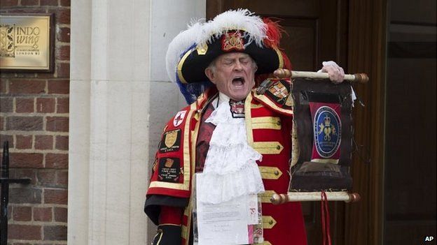 Tony Appleton, a town crier, announces the birth of the royal baby outside the Lindo Wing