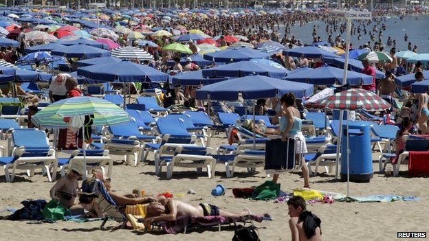 A Benidorm beach busy with tourists