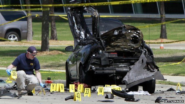 FBI agent examines car used by gunmen outside the centre in Garland. 4 May 2015