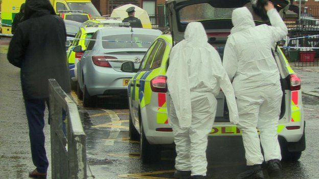 Forensic scientists at scene of fatal shooting