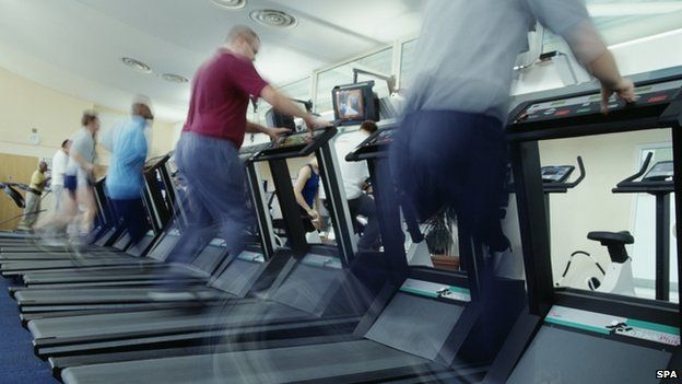 Men running at treadmills