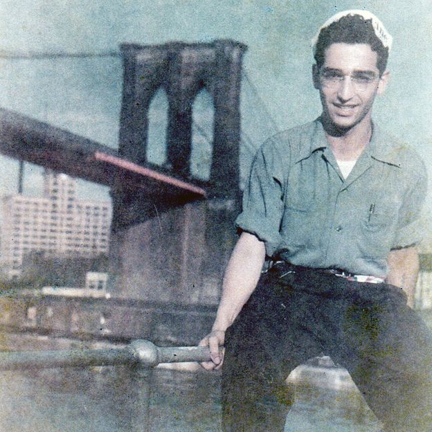 Gunter (Gary) Wolff photographed against a backdrop of the Brooklyn Bridge after he arrived in New York