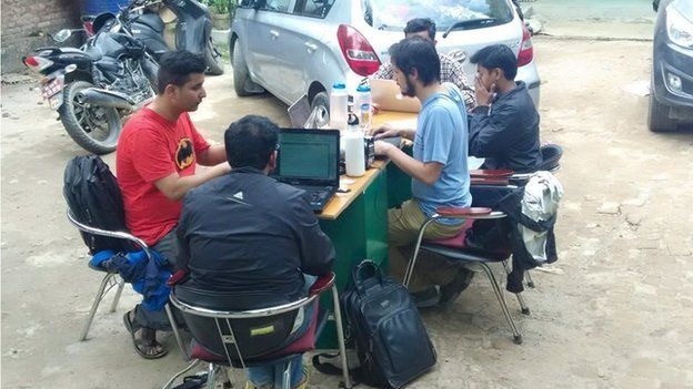 Kathmandu Living Labs team working in a parking lots because aftershocks continued after the quake