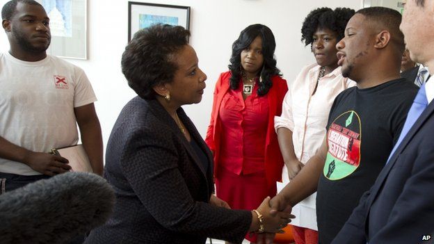 Attorney General Loretta Lynch shakes hands with community activists at Baltimore University