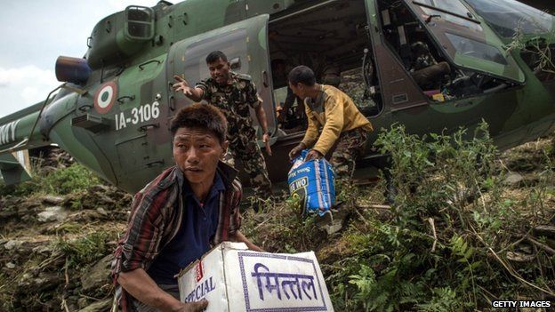 Villagers collect aid in Nepal