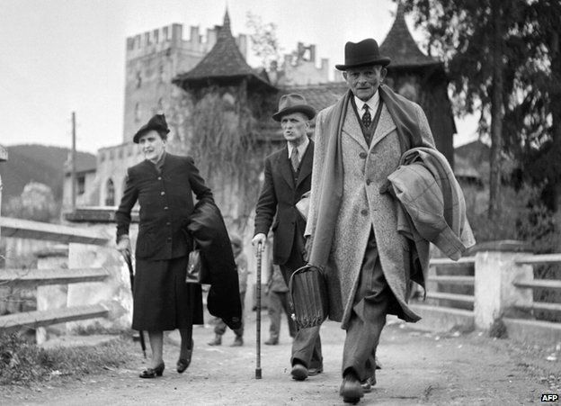 Gen Weygand (right) and wife leaving Schloss Itter, May 1945