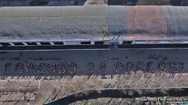 Lines of prisoners forming a message seen from the air