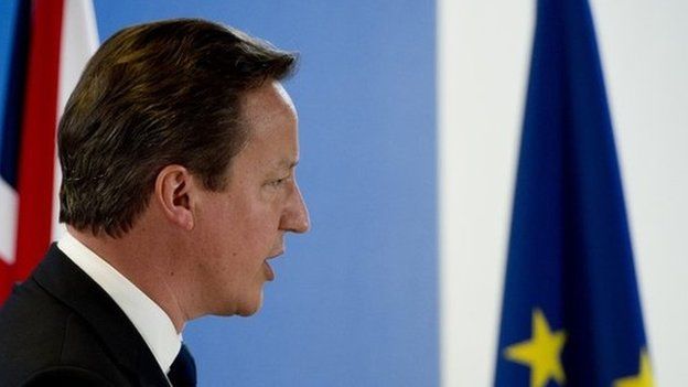 British Prime Minister David Cameron holds a press conference as part of a European Council on June 27, 2014, in Brussels