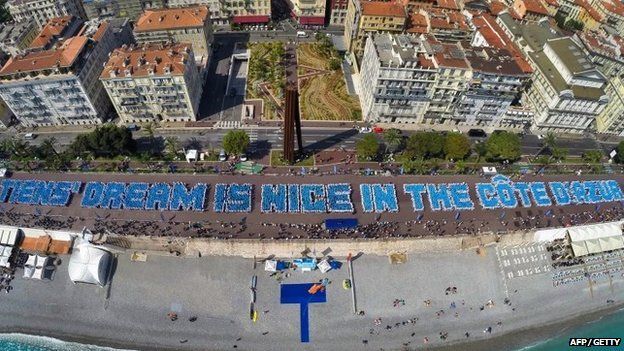 Tiens' employees spell out the words "Tiens' dream is Nice on the Cote d'Azur" in France on 8 May 2015