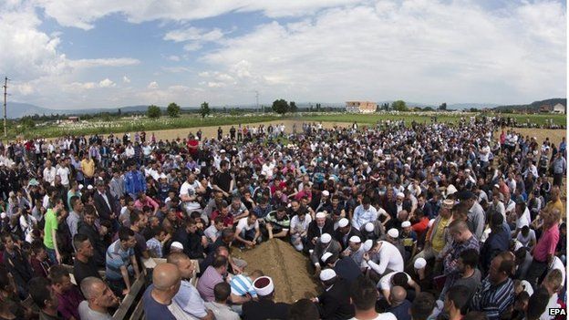 Ethnic Albanians in the village of Studenicani pray during the funeral of Isamedin Osmani, one of the police officers killed in the Kumanovo operation