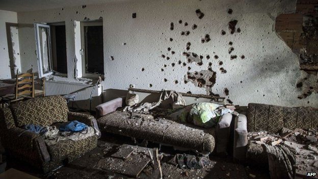 A bullet-riddled wall in a house following clashes between Macedonian police and an armed group in Kumanovo on 10 May 2015.