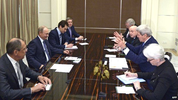 Russian President Vladimir Putin (second left) meets US Secretary of State John Kerry during their meeting at the Bocharov Ruchei residence in Sochi (12 May 2015)