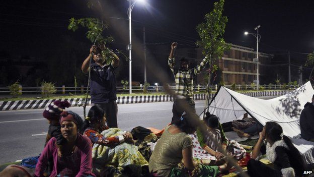 Kathmandu residents prepare for another night out in the open, 12 May