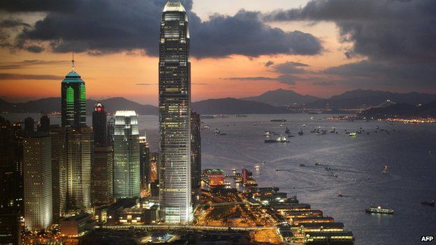 The International Finance Centre towers over the southern Chinese city's Central district, illuminated during dusk in Hong Kong