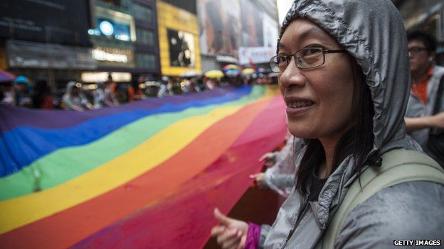 People march in Causeway Bay district during the Gay Pride Parade in Hong Kong on 8 November 2014