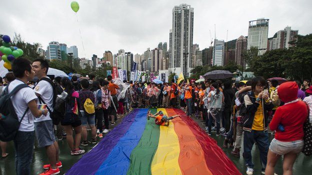 People gather at Victoria Park ahead the Gay Pride Parade in Hong Kong on 8 November 2014