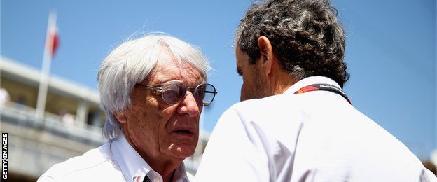 Bernie Ecclestone speaking to former driver Alain Prost