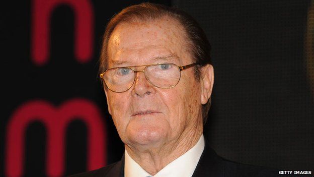 Sir Roger Moore wins damages over 'grope' claim - BBC News