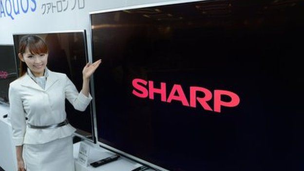 A model of Japan's electronics maker Sharp shows off new 4k liquid crystal display (LCD) TV