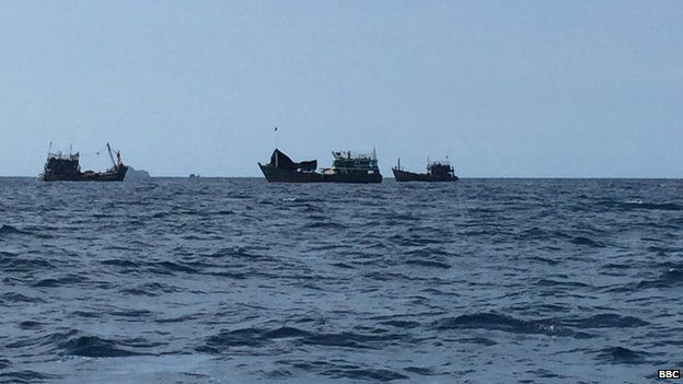 The boat surrounded by Thai fishing boats