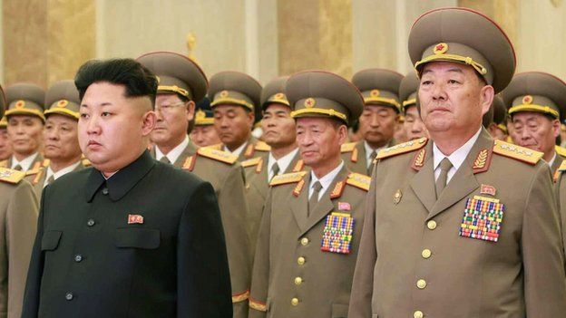 This photo, taken on 16 February 2015, shows North Korean Defence Minister Hyon Yong-chol (R) alongside Kim Jong-un