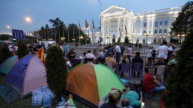 Protesters sit by tents outside government building in Skopje. Photo: 17 May 2015