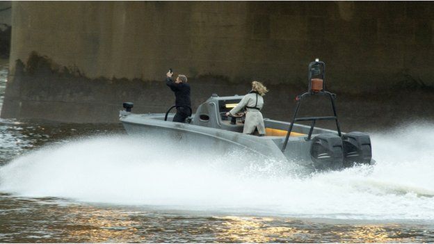 A Daniel Craig stunt double performs in a scene from the new James Bond film on the river Thames near Vauxhall,