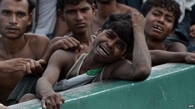 A Rohingya migrant crying as he sits with others in a boat drifting in Thai waters off the southern island of Koh Lipe in the Andaman, 14 May, 2015