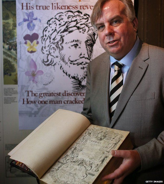 Historian Mark Griffiths holds a copy of The Herball book