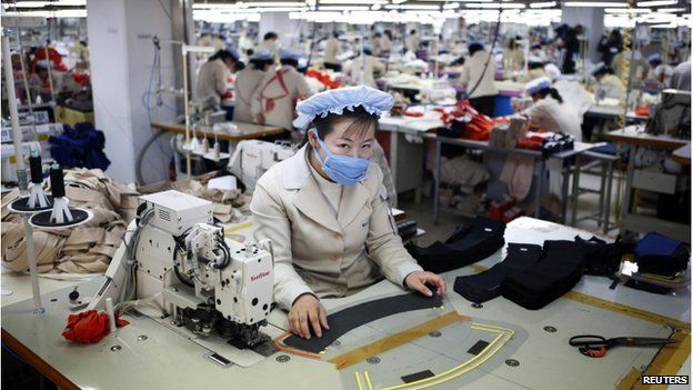A North Korean employee works in a factory of a South Korean company at the Joint Industrial Park in Kaesong industrial zone, a few miles inside North Korea from the heavily fortified border in this 19 December 2013 file photo