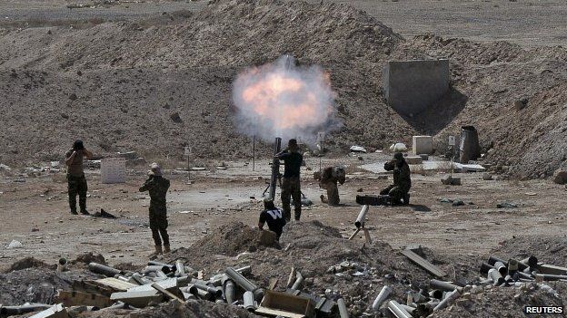 Members of the Iraqi army launch a mortar toward Islamic State militants on the outskirts of the city of Falluja, Iraq - 19 May 2015