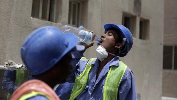 A migrant worker from Nepal takes a break on a building site in Doha, Qatar on 03 May, 2015