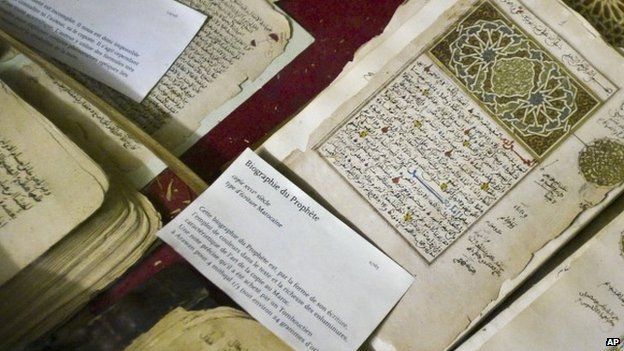 In this photo taken Tuesday, Mar. 16, 2004, some of the 20,000 preserved ancient Islamic manuscripts which rest in air-conditioned rooms are displayed at the Ahmed Baba Institute in Timbuktu, Mali.