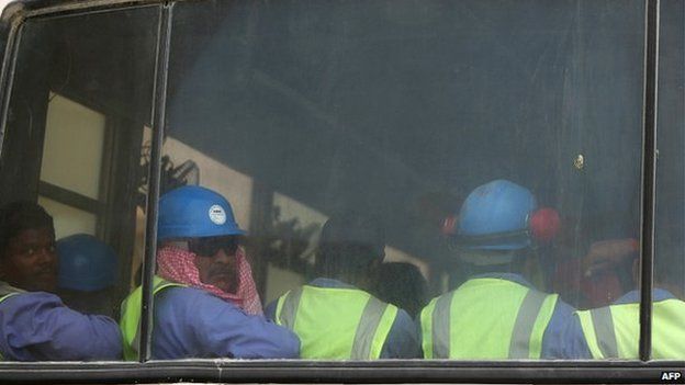 Migrant workers on a bus in Doha on 04 May, 2015